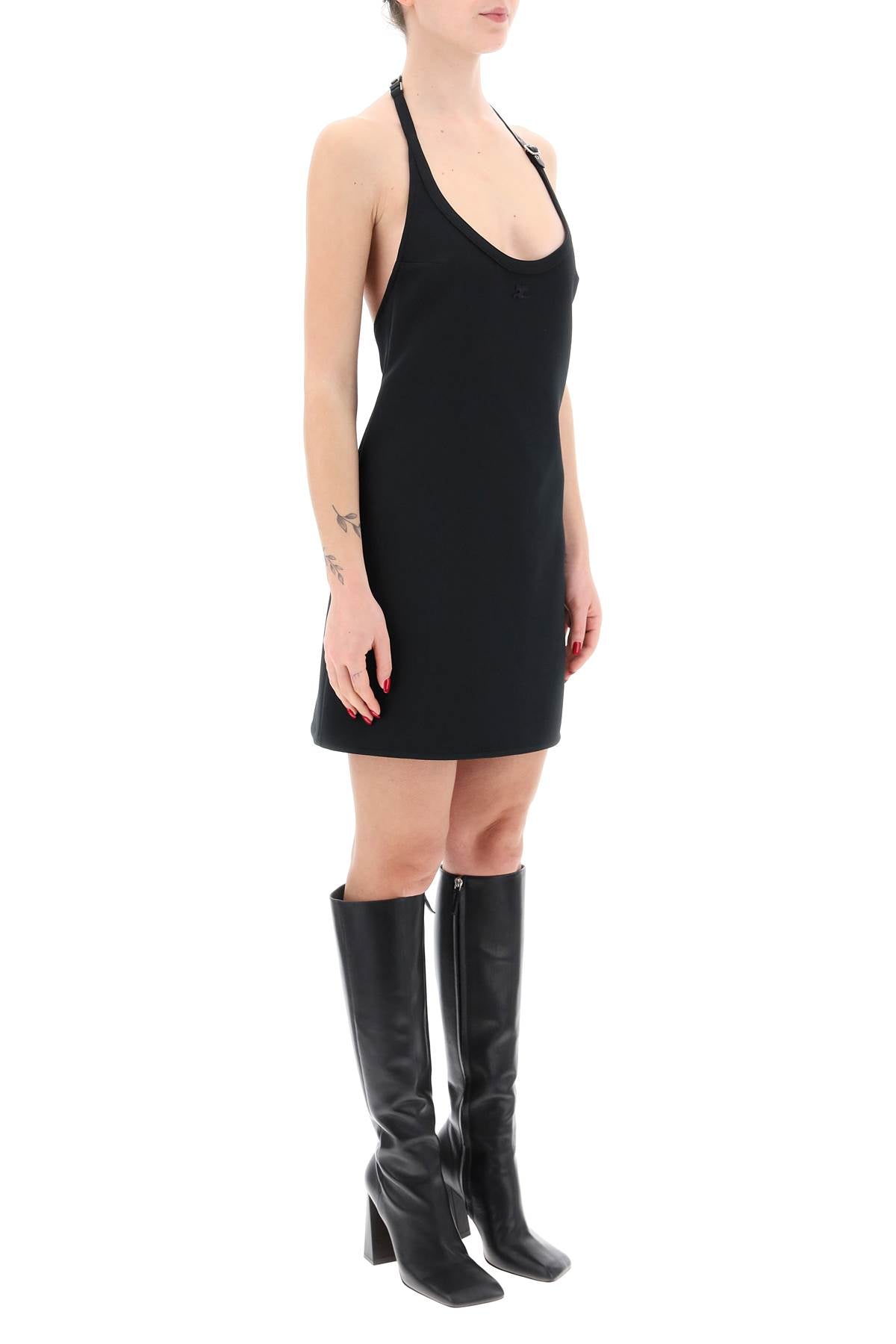 Courreges mini dress with strap and buckle detail.