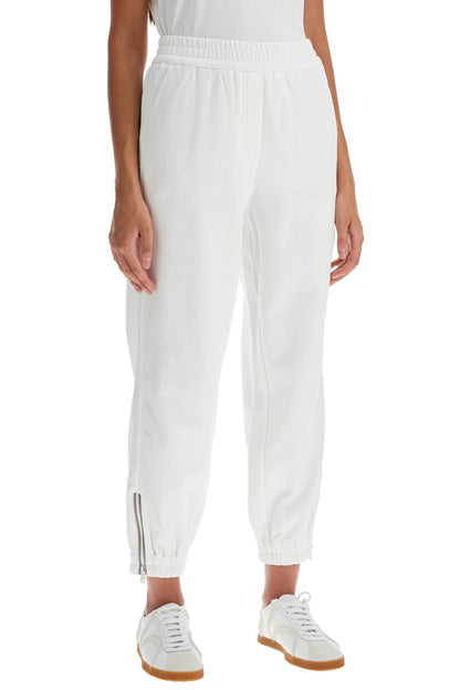 Brunello Cucinelli joggers with mobile on the