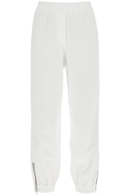 Brunello Cucinelli joggers with mobile on the