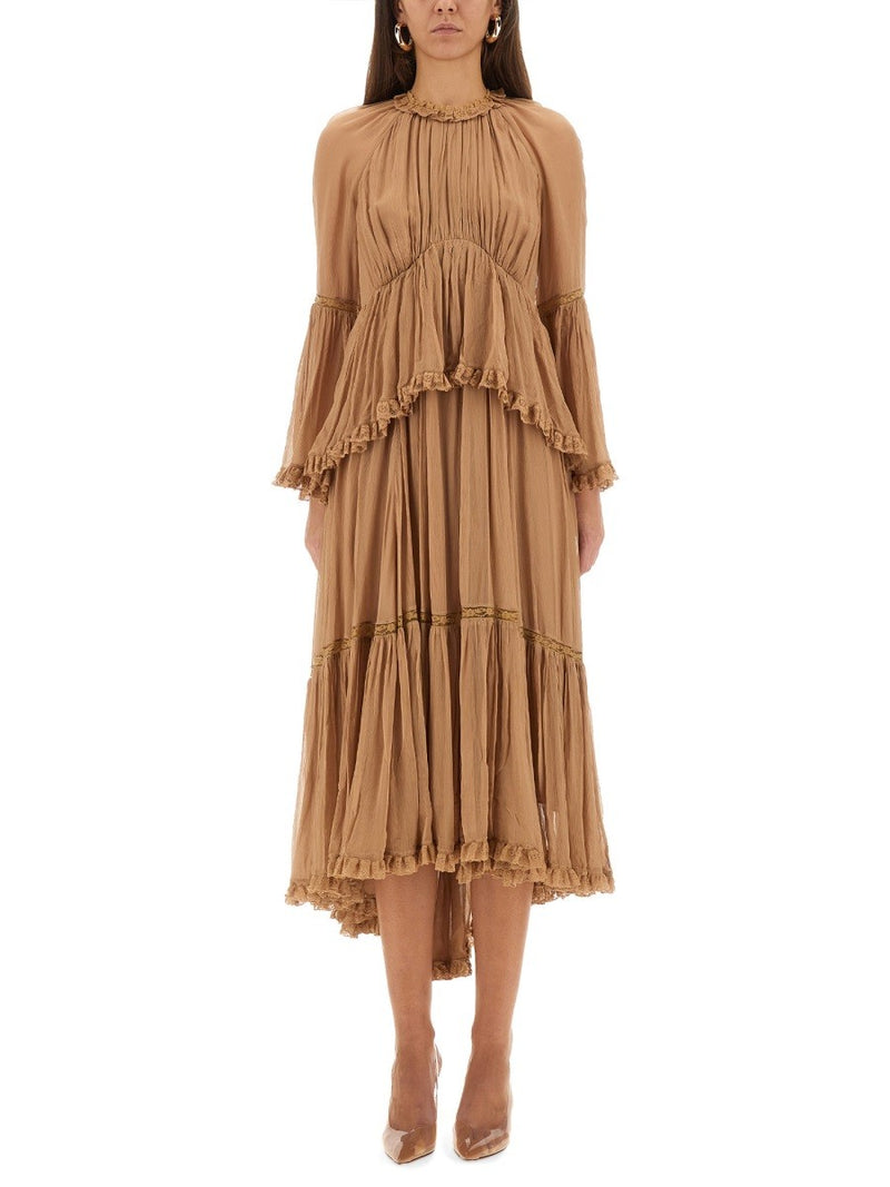 "HYPNOTIC PEPLUM" RUFFLE DRESS