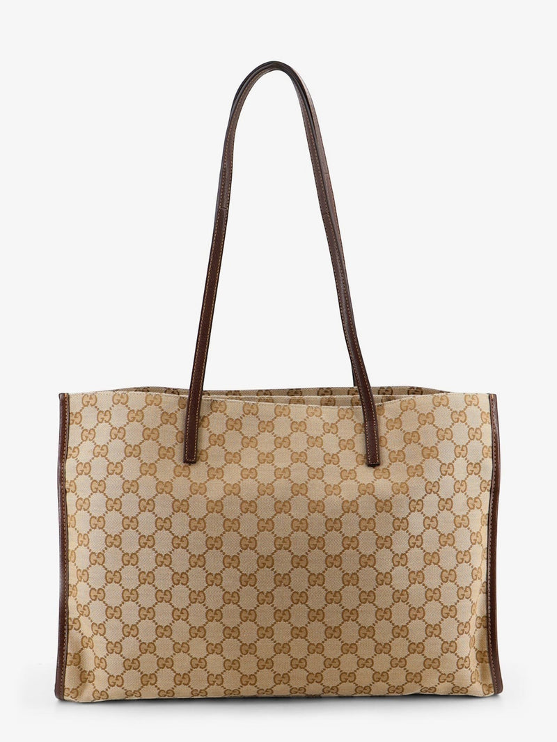 Le Loft De Paris Gucci monogram canvas tote bag in beige and brown with leather trim and slim shoulder straps.